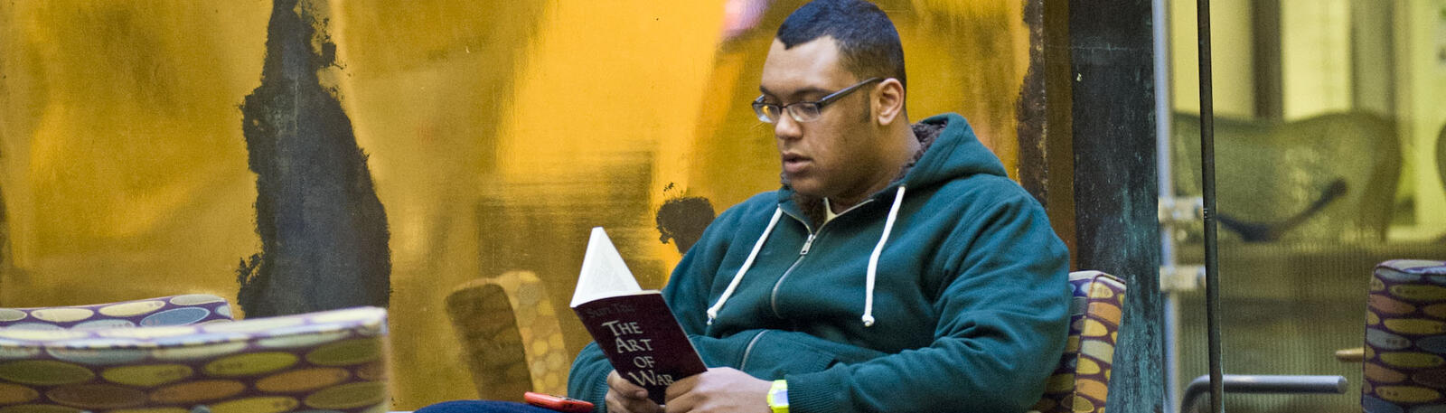 photo of a student reading in the student union
