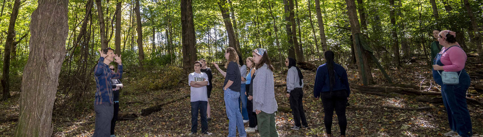 photo of students in a class in the woods at wright state